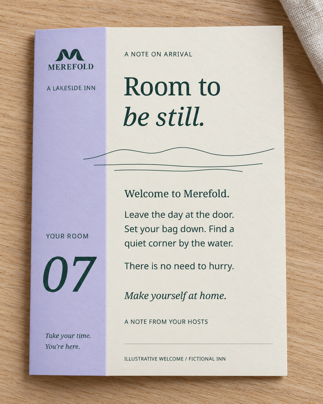 AI-generated visualization: Merefold folded welcome note with lavender room 07 spine and quiet shoreline motif.