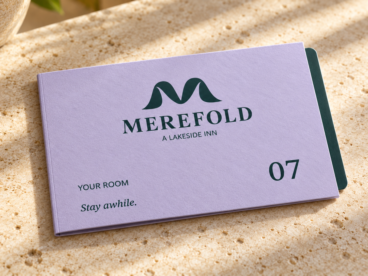 AI-generated visualization: Folded lavender room-key wallet laid flat with a pine card insert and room 07.